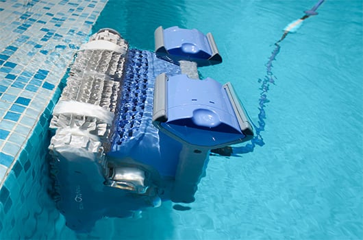 Robotic Pool Cleaner scrubbing wall